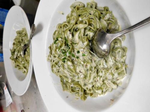 a bowl of pasta with a spoon in it at Pension Augustino in Ražanac