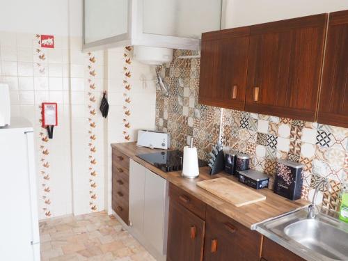a kitchen with a sink and a counter top at Bela House in Lagos