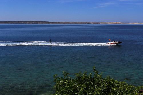 a person on a boat in a large body of water at Pension Augustino in Ražanac