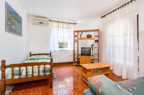 Postel nebo postele na pokoji v ubytování Apartments Silvana 1183