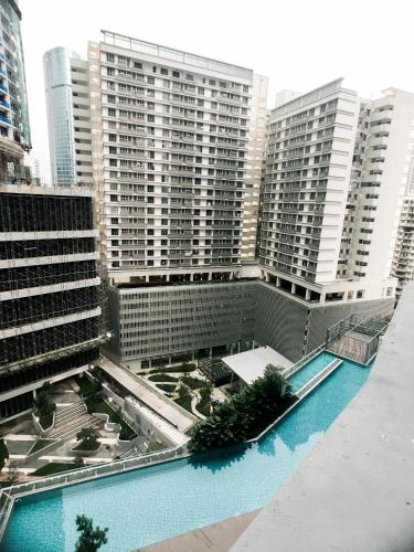 arial view of a building with a swimming pool at KL Gateway Residency in Kuala Lumpur