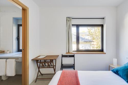 A bed or beds in a room at Casa la Devesa de Sanabria