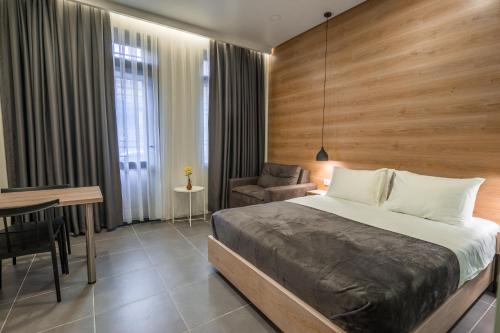 Katil atau katil-katil dalam bilik di 8 Rooms Apartotel On Meidan
