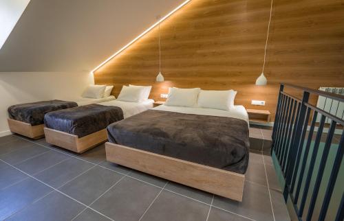 Katil atau katil-katil dalam bilik di 8 Rooms Apartotel On Meidan