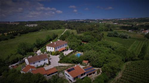 an aerial view of a house with a swimming pool at Casa D Obidos in Óbidos