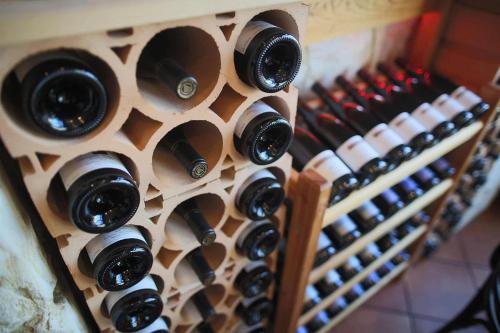 a bunch of wine bottles in a wine cellar at Aparthotel Berlin in Bad Nenndorf