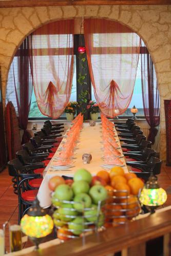 a long table with fruits on top of it at Aparthotel Berlin in Bad Nenndorf