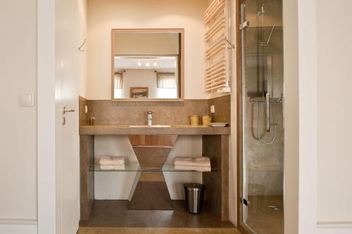 a bathroom with a sink and a mirror at Maison d'Hôte de Myon in Nancy