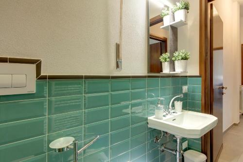 Et badeværelse på Mamo Florence - Lungarno Apartment