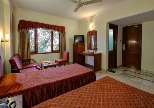 Een bed of bedden in een kamer bij Hotel Apex