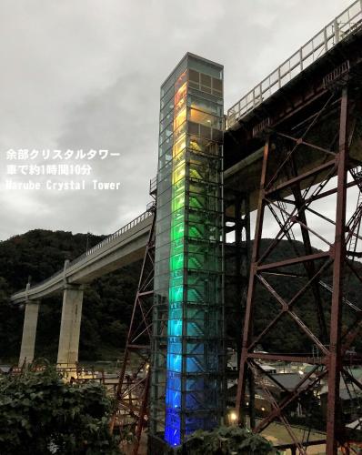 a building under construction next to a bridge at Yonagoya in Kami