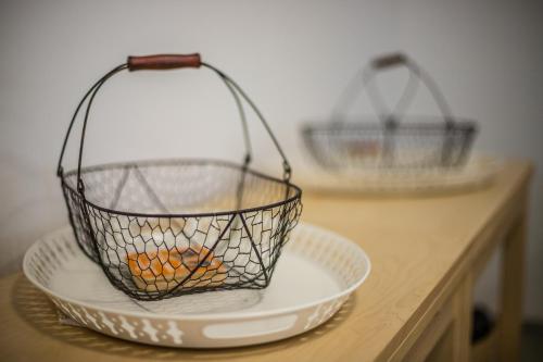 two baskets sitting on top of plates on a counter at Antošíkov majer in Banská Štiavnica