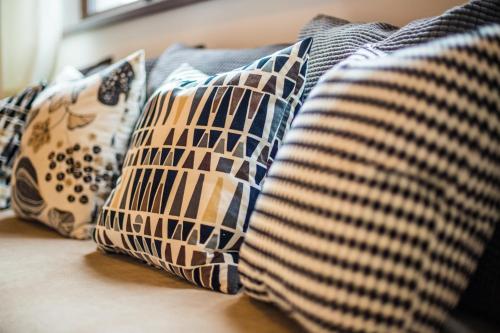 a group of pillows sitting on a couch at Antošíkov majer in Banská Štiavnica