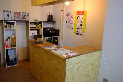 a room with a counter in a room at Asahikawa Ride in Asahikawa