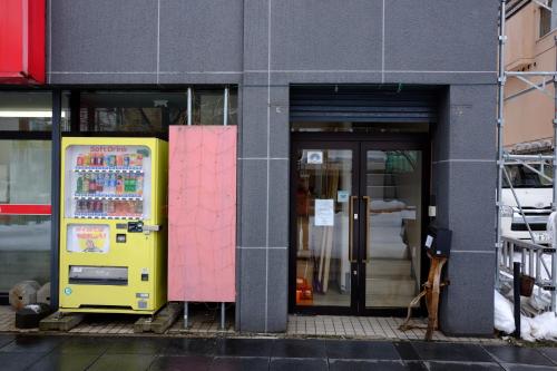 a vending machine in front of a building at Asahikawa Ride in Asahikawa
