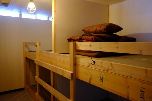 a bedroom with a bunk bed in a room at Asahikawa Ride in Asahikawa