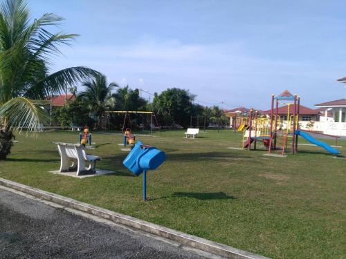 a park with children playing on a playground at Barakah Homestay in Alor Setar