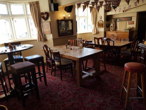 A restaurant or other place to eat at George and Dragon Ashbourne