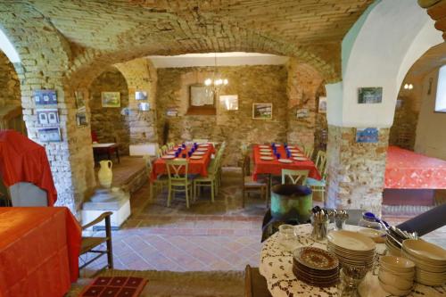 a dining room with tables and chairs in a building at Dom Przysłupowy Educare -Agroturystyka Slow Food in Świeradów-Zdrój
