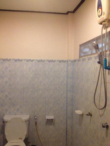 a bathroom with a shower and a toilet at Starlight Resort Koh Phangan in Thong Nai Pan Yai