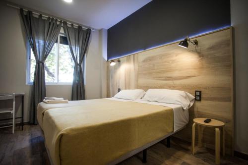 Postel nebo postele na pokoji v ubytování CC Atocha