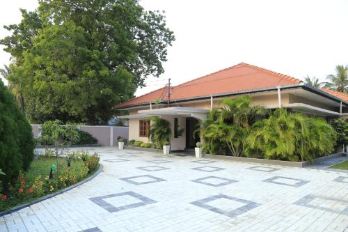 a house with a courtyard in front of it at Superior rest in Jaffna