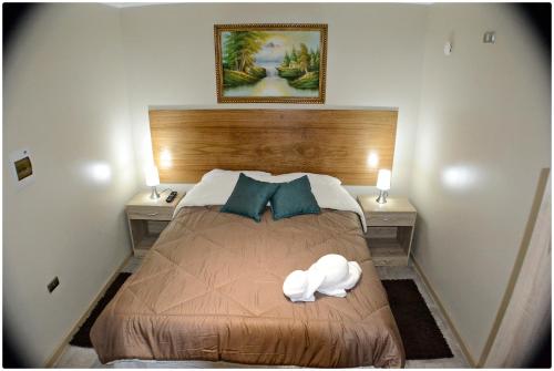 Cama o camas de una habitación en Hotel Herencia