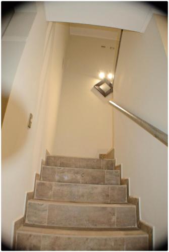 a set of stairs with a light at the top at Hotel Herencia in Chillán