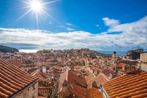 
a large building with a sky background at Villa Four Winds in Dubrovnik
