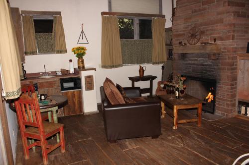 
a living room filled with furniture and a fire place at Adobe Village Inn in Sedona
