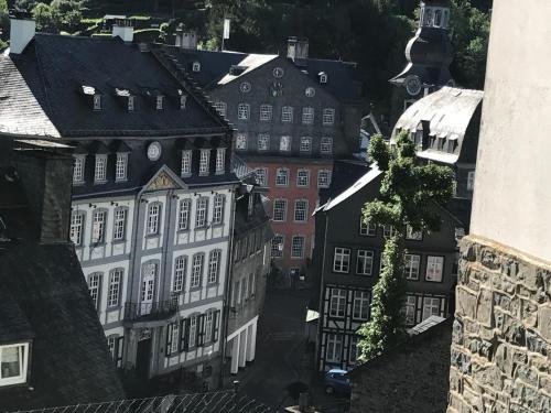 an aerial view of a city with buildings at Eifelerhof hotel Monschau in Monschau