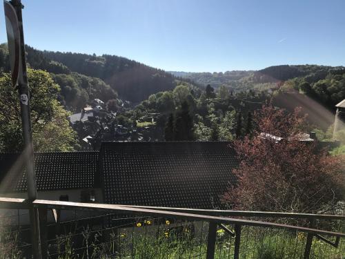 a view of a valley from a house at Eifelerhof hotel Monschau in Monschau