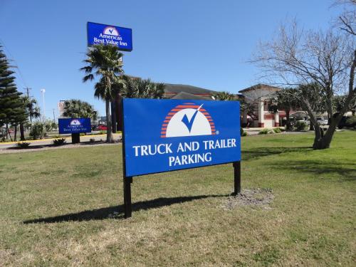 a sign for a truck and trailer parking at Americas Best Value Inn - Brownsville in Brownsville