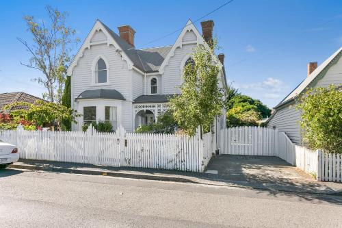 a white house with a white picket fence at Amberley - circa 1880s Luxury - 5 b'rooms sleeps 9 in Sandy Bay