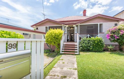 a house with a porch and a balcony at 99 Kirkland Bed & Breakfast in Brisbane