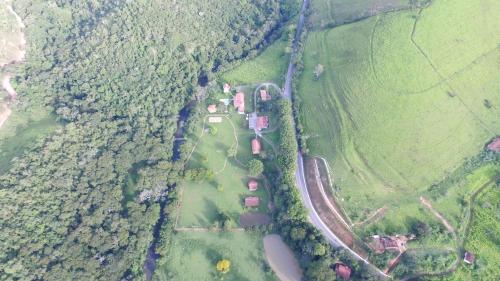 an aerial view of a farm in a field at Pousada Ribeirão do Ouro in Itamonte