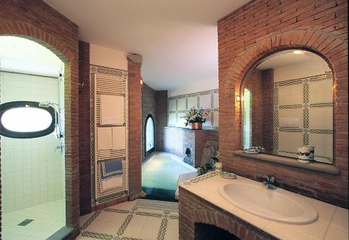 a bathroom with a sink and a bath tub at Hotel La Tonnarella in Sorrento