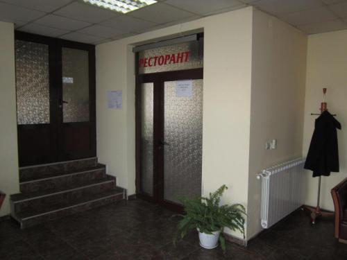 a lobby with a door with a hospital sign on it at Germanea Hotel in Sapareva Banya