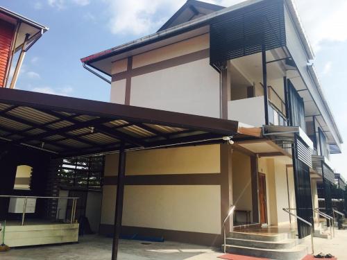 a house being constructed with a metal roof at Metha Palace in Sakon Nakhon