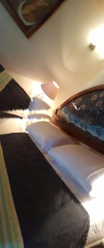 a bedroom with two beds with pillows at Casa Ofelia in Mazunte