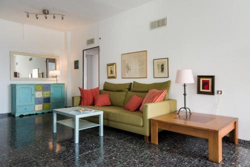 a living room with a couch and a table at Eshkol Housing Carmel Center: Forest retreat in Haifa