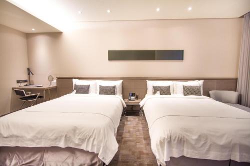 Voodi või voodid majutusasutuse Hotel Reve Taichung toas