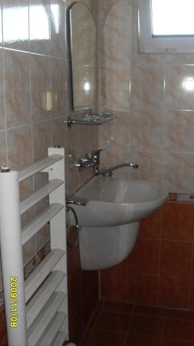 a bathroom with a sink and a mirror at Germanea Hotel in Sapareva Banya