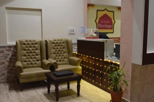 a waiting room with two chairs and a table at Jaipur Hotel New - Heritage Hotel in Jaipur