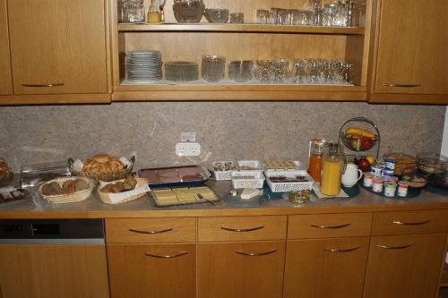a kitchen with a counter with some food on it at Hotel Garni Haus Anita in Liesing