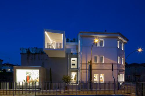 a white building with a light on top of it at Ai Bastioni Boutique Hotel in Treviso