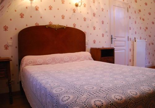 Au Domaine de Rimou tesisinde bir odada yatak veya yataklar