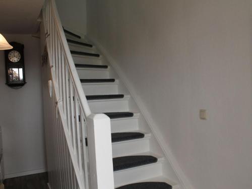 a white staircase in a house at Wohnung in Neubukow nahe Ostseestrand in Neubukow