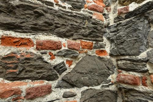 a stone wall with a brick wall and a brick wall at B&B dell'Acquario in Genoa