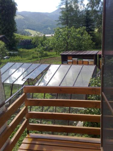 a view from the door of a garden with a glass roof at Forester Apartment Zuberec in Zuberec